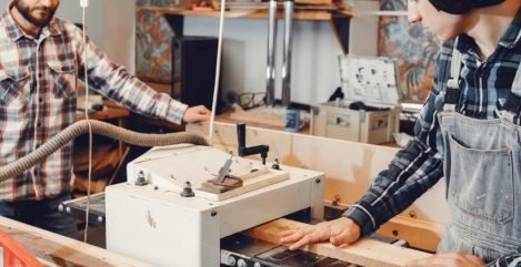 the-carpenter-works-with-a-tree-HUVC5QT-469x241